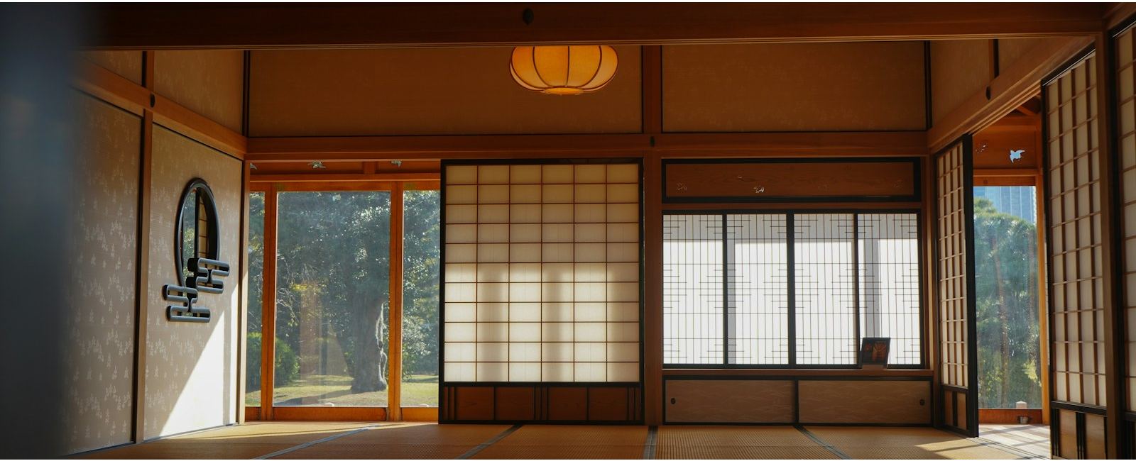 A spacious traditional Japanese tatami room with shoji screens